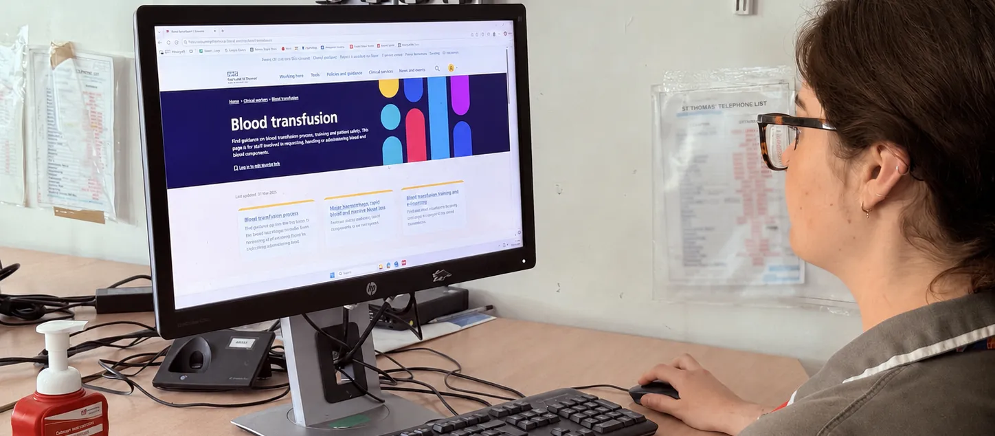 Person sitting at a desk viewing the NHS blood transfusion guidance webpage on a computer.